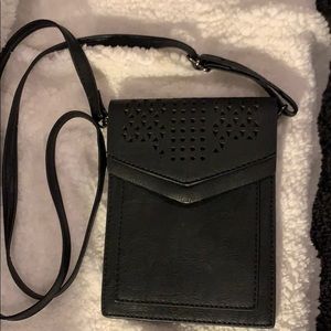 Minicat Black crossbody purse.